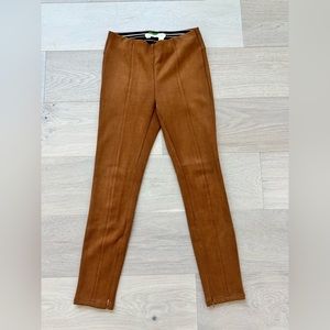 Stirrup type tan pants with stretch waistband